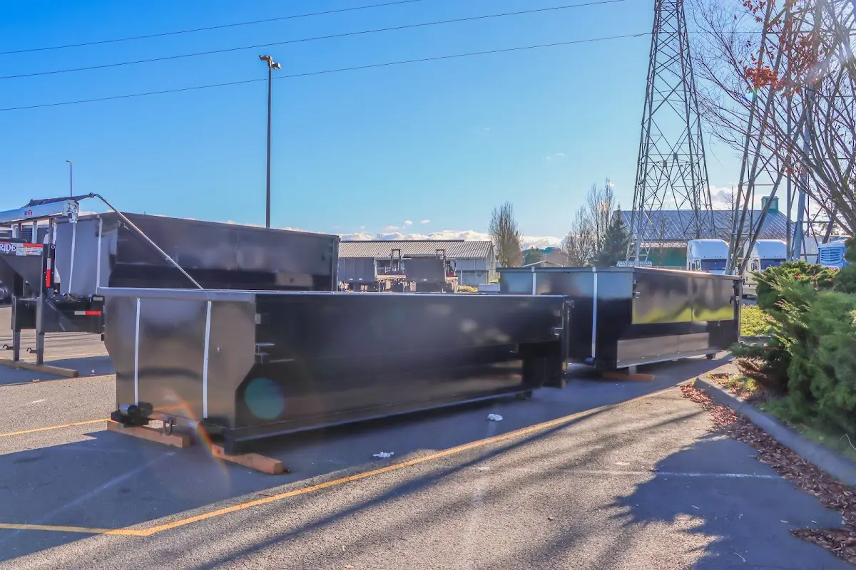 Roll-off dumpster ready for waste disposal at job site for Concrete Dumpster Rental in Amsterdam
